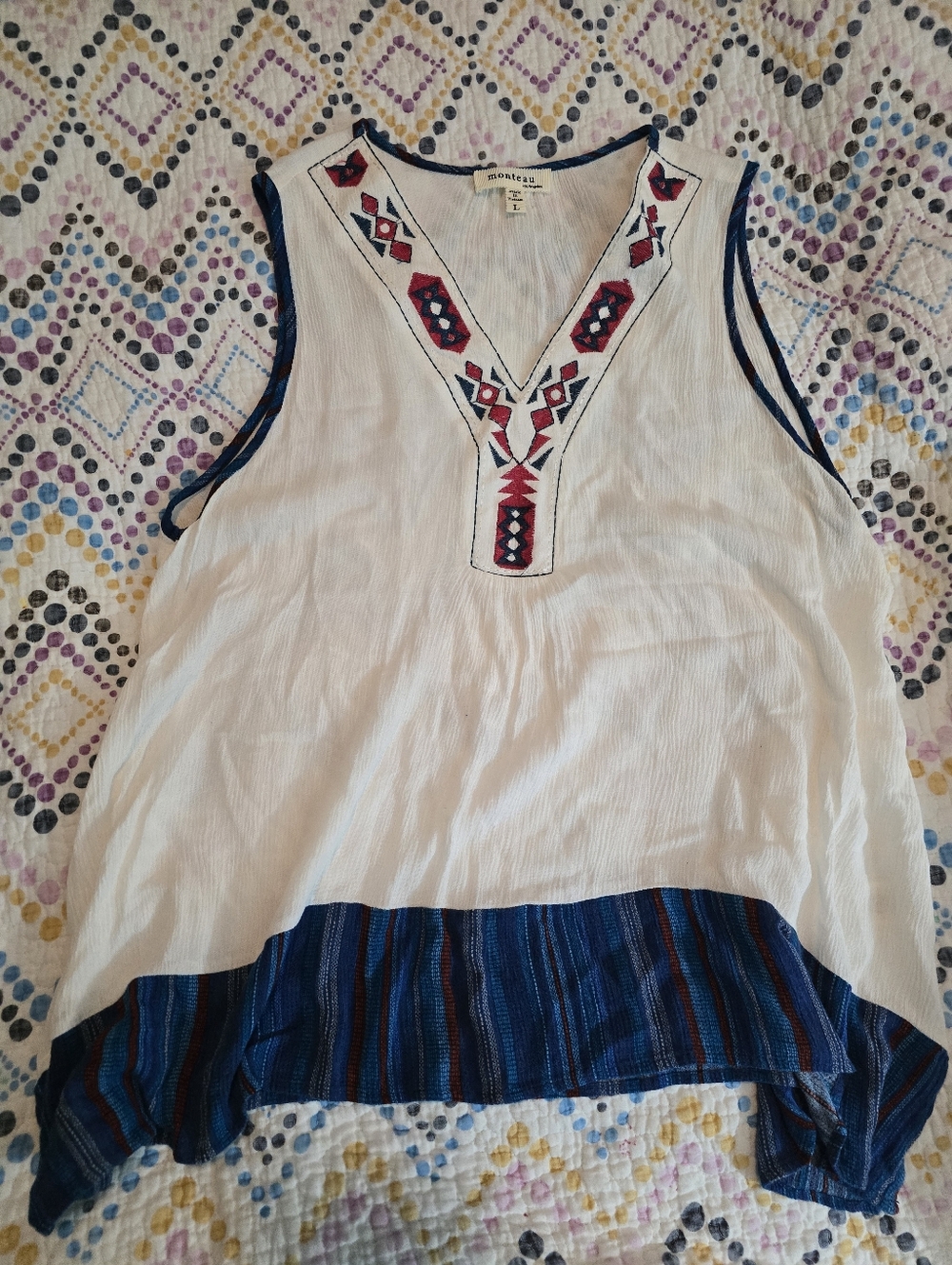Monteau Los Angeles sleeveless top with blue and red embroidery and a patterned